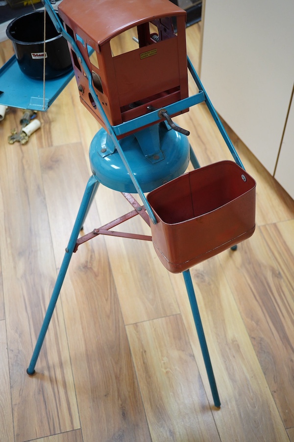 A 1950s Tri-ang large scale tinplate dockside crane with accessories including; a metal bucket, a plastic wrecking ball, etc. 88cm high to top of cab. Condition - fair to good, small patches of surface rust and some mino